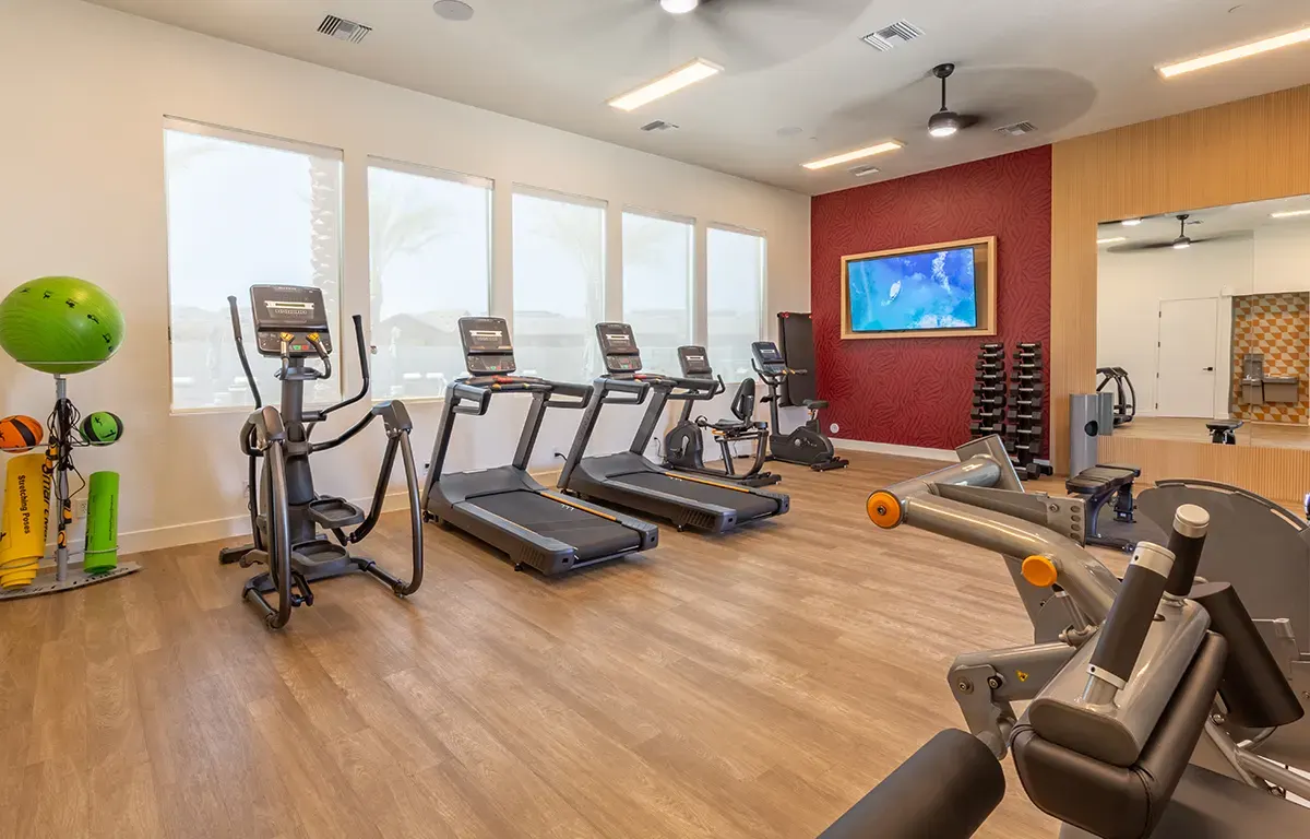 Fitness center cardio equipment at Village Sonoran Vista.