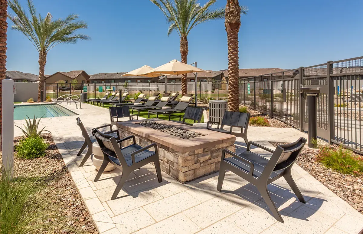 Outdoor table and lounge chairs at Village Sonoran Vista.