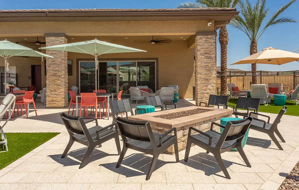 Outdoor fire-pit table beside the clubhouse at Village Sonoran Vista.