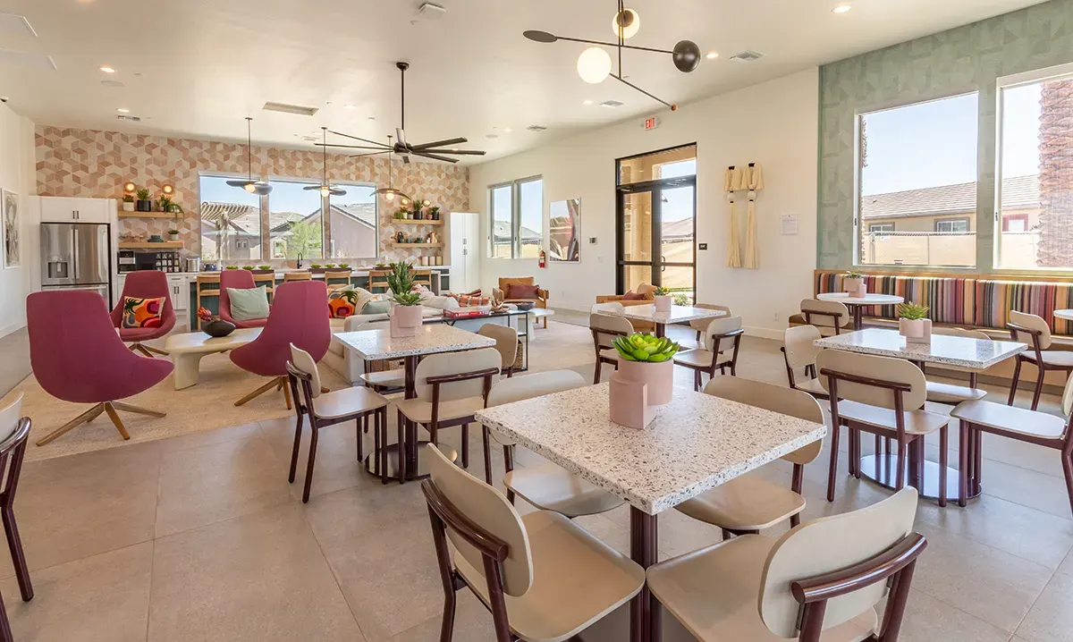 Clubhouse shared dining tables at Village Sonoran Vista.