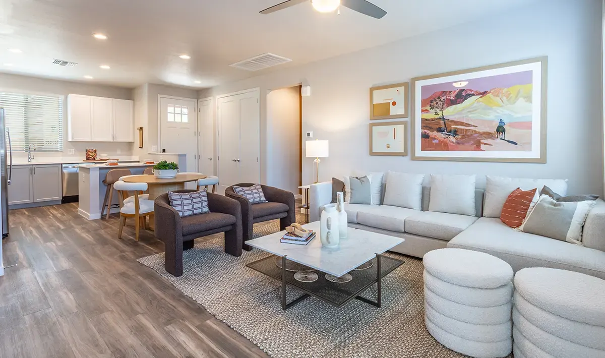 Living room opening to the kitchen at Village Sonoran Vista.