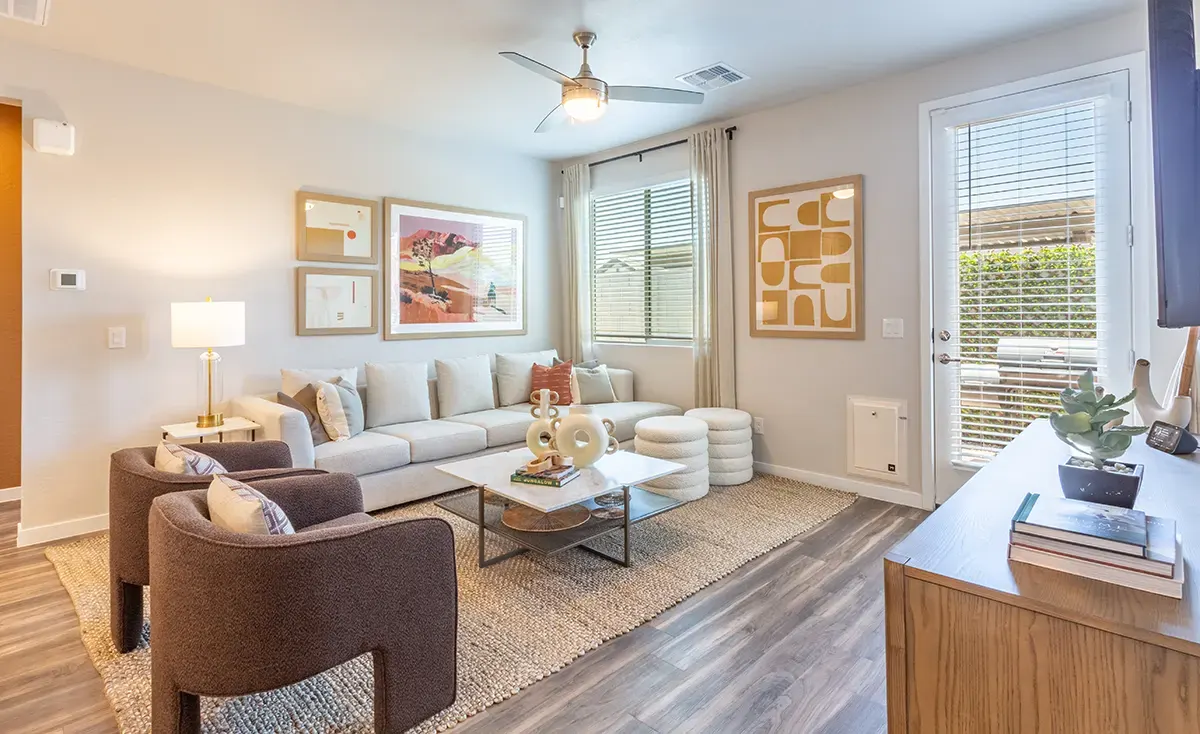 Living room and large windows at Village Sonoran Vista.