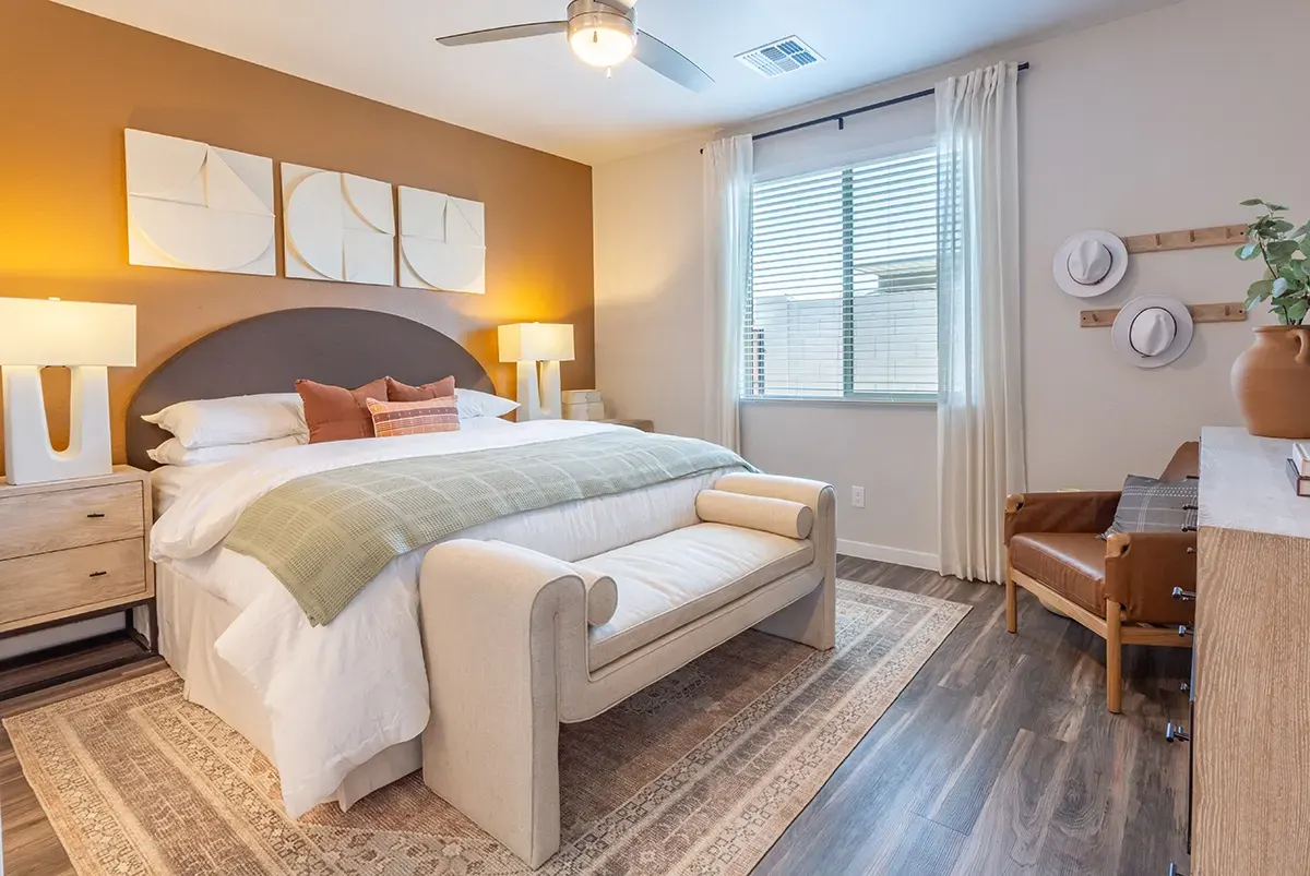 Bedroom with desk and window at Village Sonoran Vista.