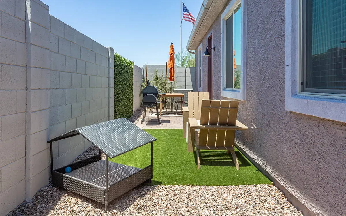 Enclosed backyard with dog shelter at Village Sonoran Vista.