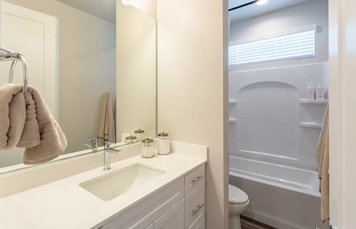 Bathroom vanity and tub-shower at Village Sonoran Vista.