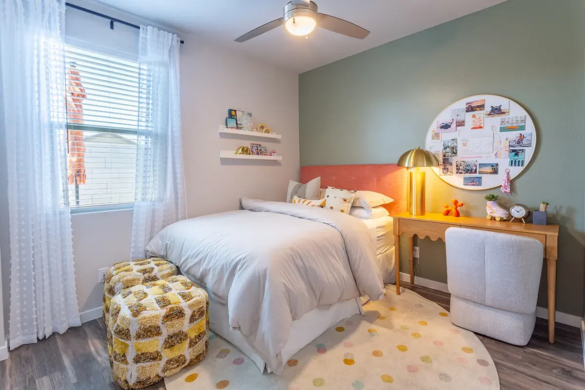 Bedroom with desk and window at Village Sonoran Vista.