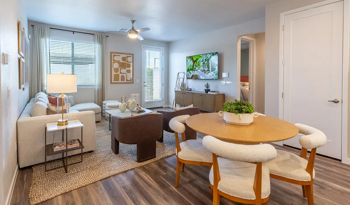 Living room with dining table at Village Sonoran Vista.